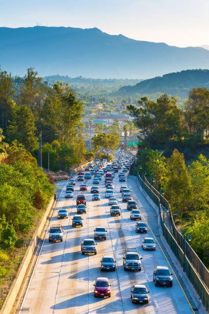 Los Angeles Skyline, California, USA Early morning rush hour on Interstate 110 towards Los Angeles City, California, USA. los angeles traffic jam stock pictures, royalty-free photos & images