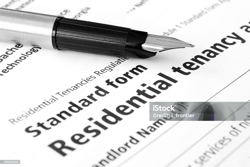 Residential tenancy agreement Close-up of Residential tenancy agreement (black&white) document with pen on it Black And White Stock Photo