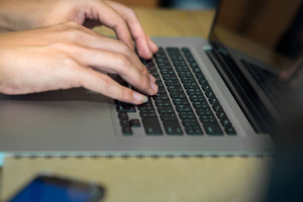 istock Close Up man Typing On The Keyboard 1333027155