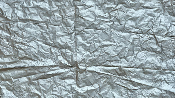 istock Crumpled Plastic Bag Texture, Gray Creased Plastic Sheet, Abstract Shapes for Background. 1333029947