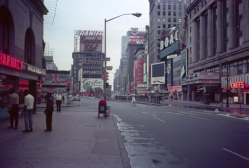 Times Square, New York City, NY, USA, 1964. Times Square street scene. Furthermore: pedestrians, tourists, theaters, cinemas, shops and advertising signs.