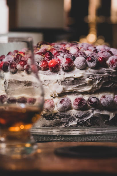 Sugared cranberry topped gingerbread cake and a drink ready for Christmas party