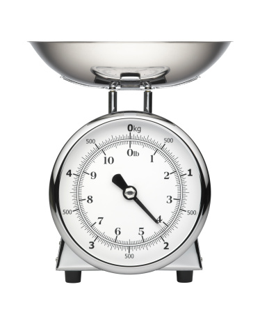 A modern chrome kitchen scale isolated on a white background. Includes an embedded clipping path.