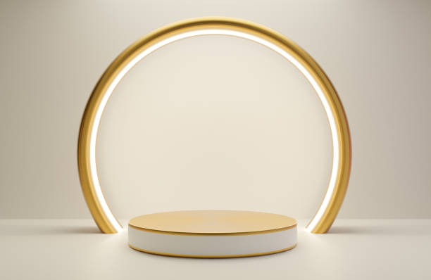 istock White and Gold podium for product presentation on white wall background luxury style.,3d model and illustration. 1333040451