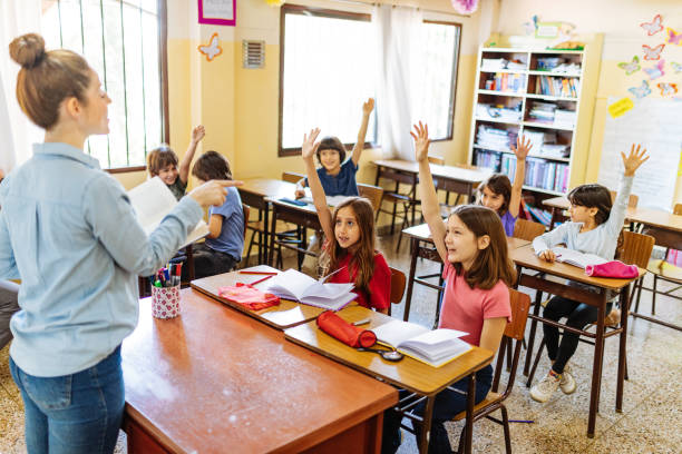 istock Elementary education in Latin America - pupils writing in theirs notebooks in classroom 1333043005