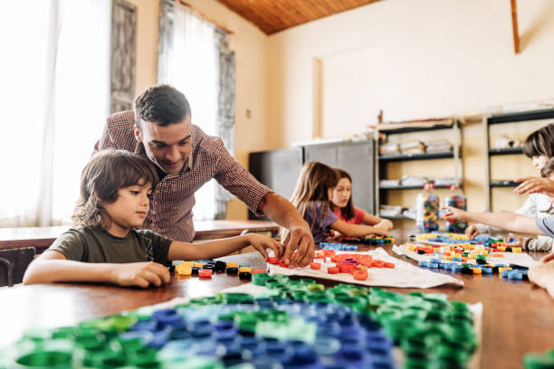 istock Teacher motivating kids to be active in classroom 1333043597