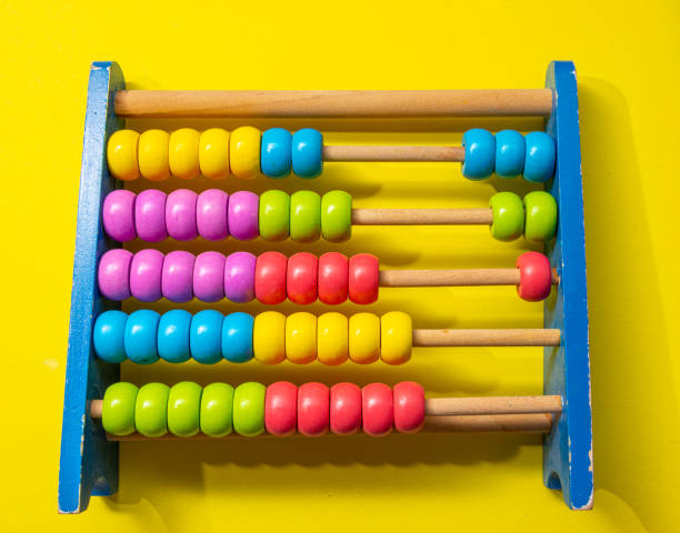 istock colourful abacus on yellow background ,concept of learning maths and accounting 1333043832