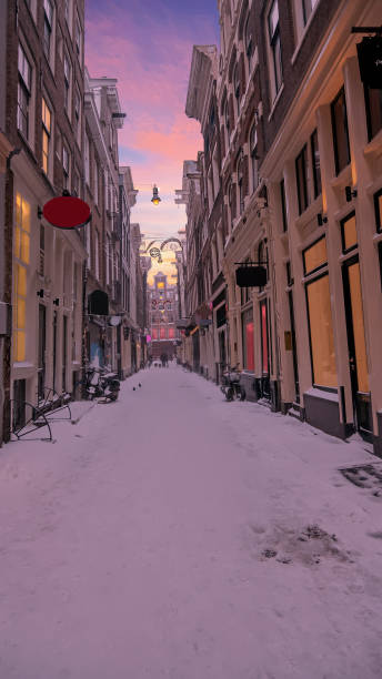 istock Snowy Red LIght District in winter in Amsterdam the Netherlands at sunset 1333047793