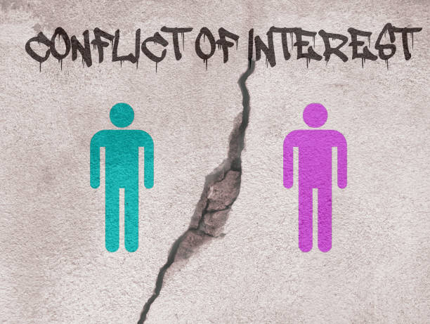 istock Conflict of Interest text written on wall with crack separating two persons. Concept for mediation, resolving conflict, dispute. 1333051066