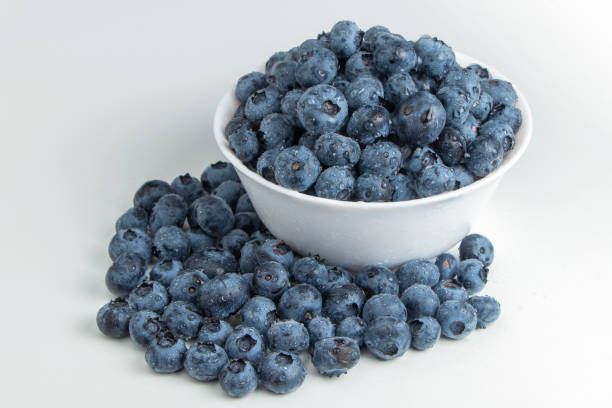istock Blueberries in bowl isolated on white background 1333051083