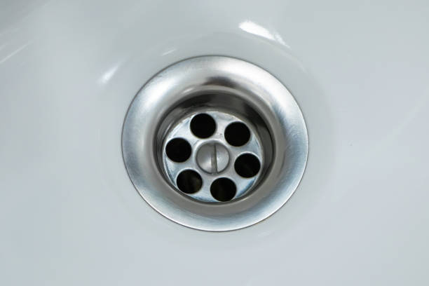 istock Standard round drain hole in white domestic sink 1333053039