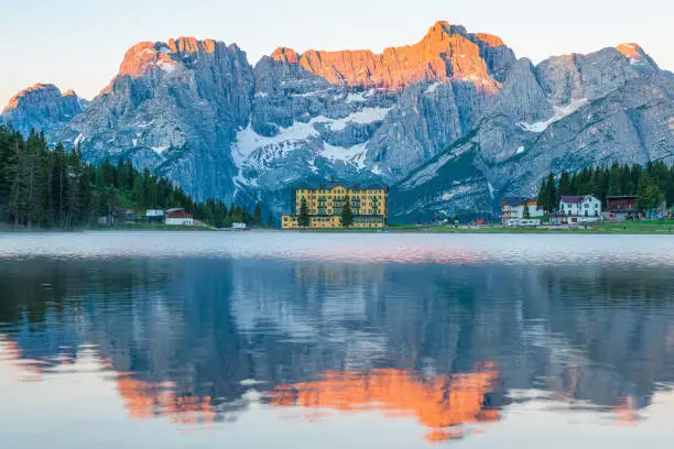 Sunrise at Misurina Lake in Dolomites mountains in Italy near Auronzo di Cadore with Sorapis mountain in the background. South Tyrol, Dolomites