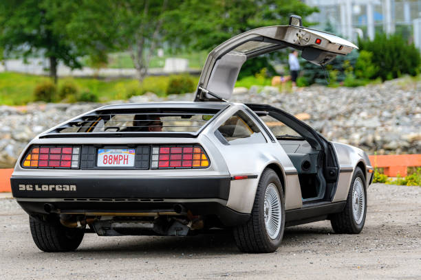 DeLorean With passenger door open Saint John, NB, Canada - July 18, 2021: A DMC DeLorean parked with passenger door open. License plate reads 88MPH, from the movie Back To The Future. time machine stock pictures, royalty-free photos & images