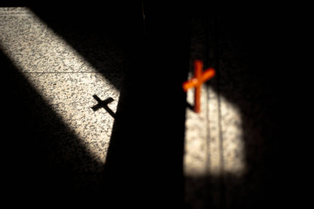istock Light, shadow, cross of wood. 1333059283
