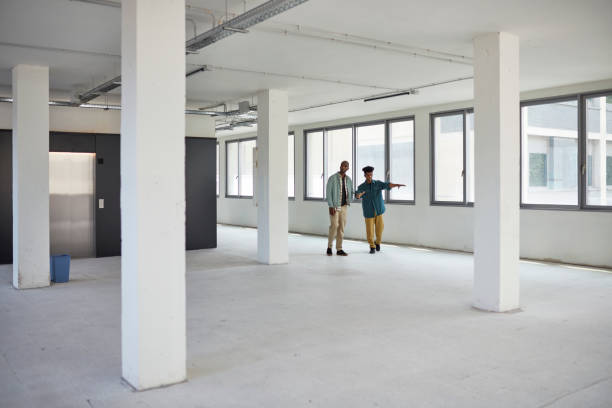 Commercial Real Estate Agent Showing Office Space to Client