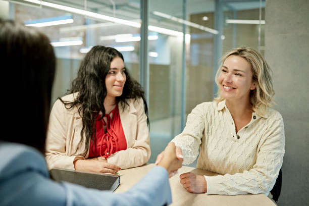 istock Smiling Gay Couple Finalizing Real Estate Transaction 1333062119