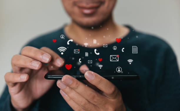 istock Close up hands holding smartphone. man using cellphone for marketing  and searching data and social media on internet. technology business investment concept 1333064136