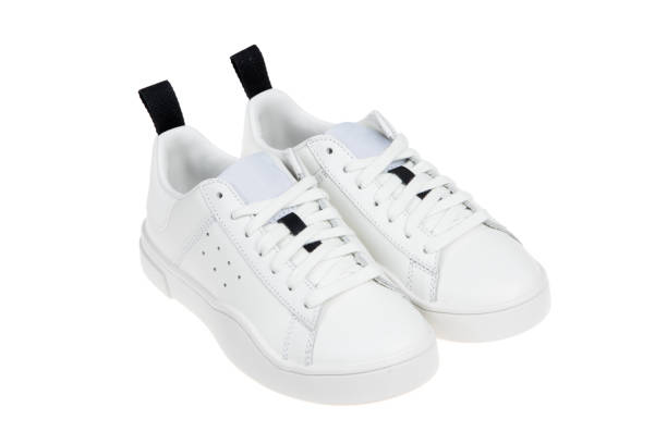 istock Pair of new white sneakers, isolated on white background 1333064187