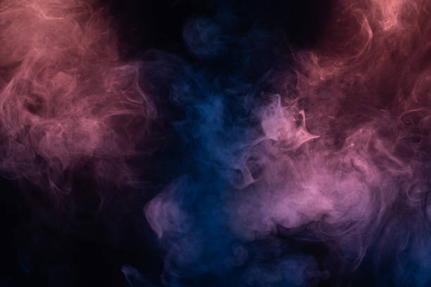 istock Blue and pink steam on a black background. 1333066721