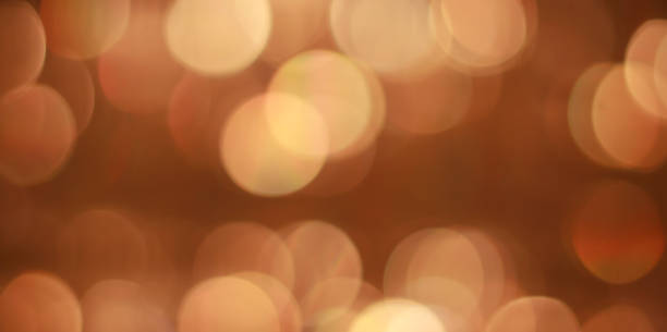istock Background with bokeh for design. Natural golden lights. 1333067400