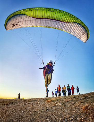 Parachute in the sky. Skydiver is flying a parachute in the blue sky. High quality photo