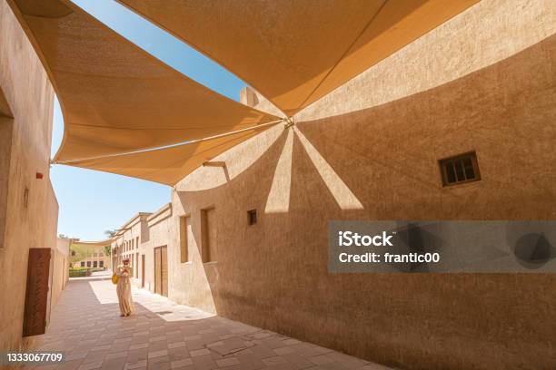 A Narrow Street In The Bur Dubai And Creek Area With Canvas Curtains To Create Shade Stock Photo - Download Image Now