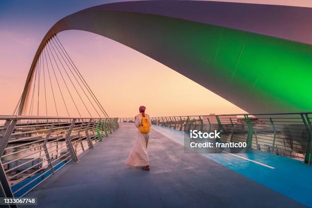 Woman Tourist Walks On The Tolerance Suspension Bridge In Dubai Popular Travel Attractions In The United Arab Emirates Stock Photo - Download Image Now