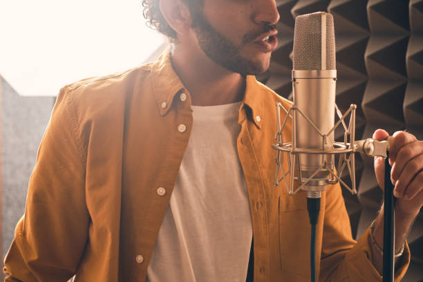 istock Man singing in the music studio 1333069244
