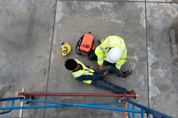 istock First aid support accident at work of construction worker at site. Builder accident falls scaffolding on floor 1333069458