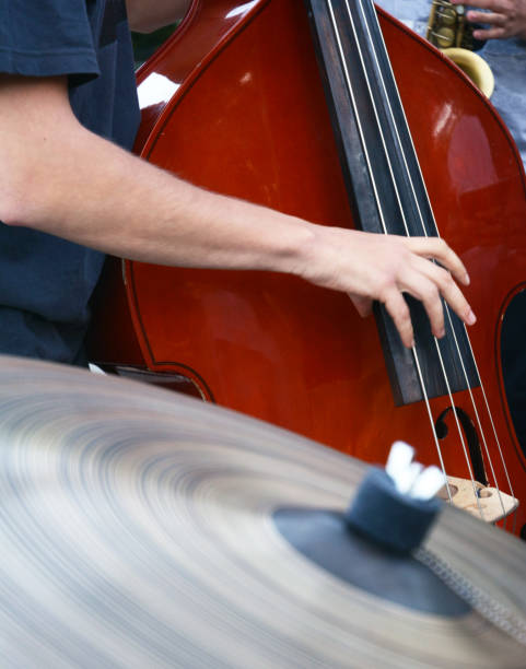 istock A hand on a double bass and a cymbal in front of them 1333071640