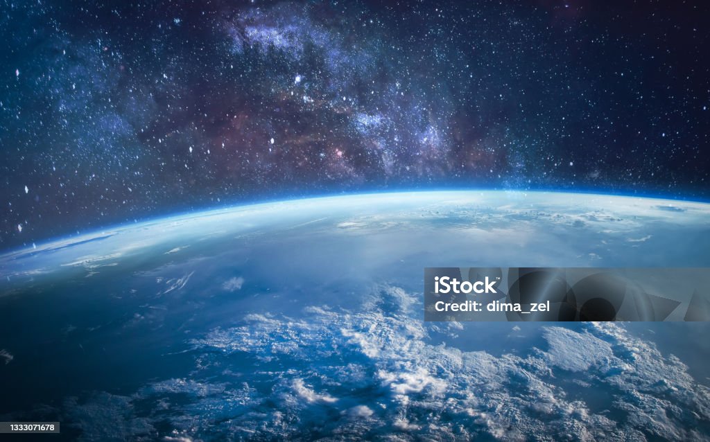 Earth planet surface in outer space. Stars and milky way on background. Sci-fi space wallpaper. Elements of this image furnished by NASA Earth planet surface in outer space. Stars and milky way on background. Sci-fi space wallpaper. Elements of this image furnished by NASA (url:https://www.nasa.gov/sites/default/files/thumbnails/image/iss060e007297.jpg) Outer Space Stock Photo