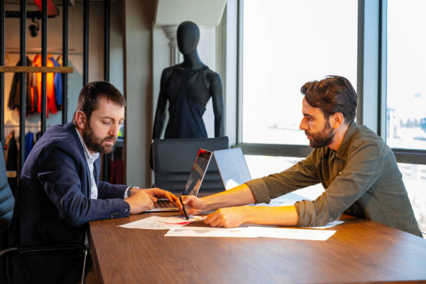 istock Two young businessmen discuss or plan project in office 1333072057