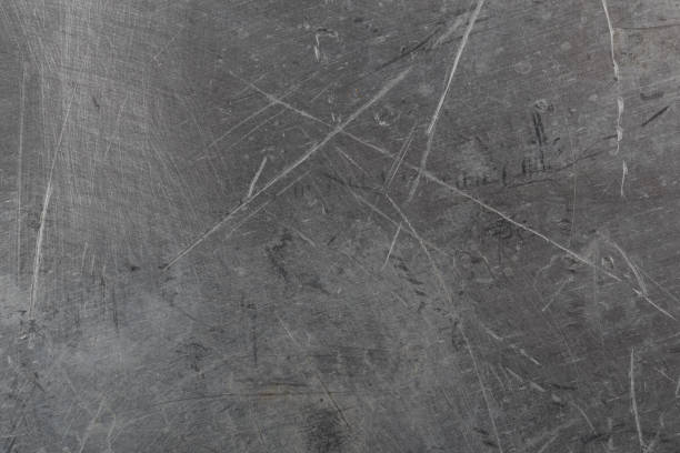 scratched real life old aluminuim flat sheet texture and full frame background.