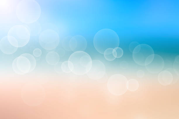 istock Abstract sea background. Abstract tropical sandy summer beach background with bokeh lights on light blue sky and sun. Beautiful texture. Space. 1333075778