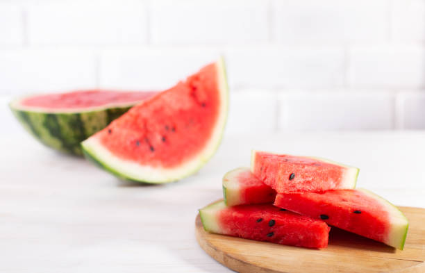 istock Watermelon slices on wooden borad on white background 1333075817