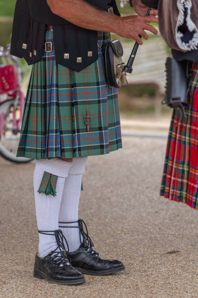 Langrune-Sur-Mer, France: Auld Alliance Pipe Band Langrune-Sur-Mer, France - 08 05 2021: Auld Alliance Pipe Band: Detail of the costume and instrument of a bagpiper tank musician stock pictures, royalty-free photos & images