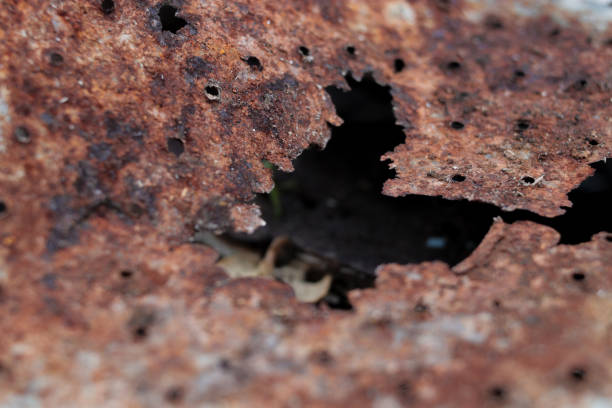 istock Defocused abstract background of rusty metal with holes 1333081053