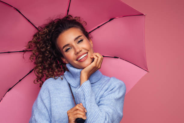 istock Girl with pink umbrella 1333082016