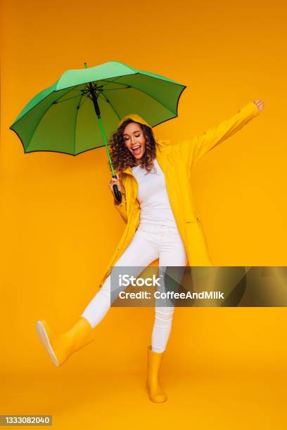 Girl With Green Umbrella Stock Photo - Download Image Now - Umbrella, Women, Rain