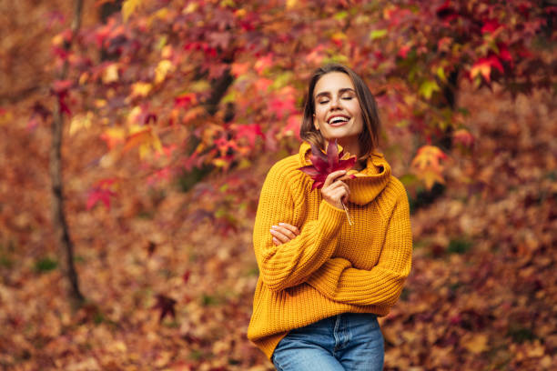 istock Beautiful woman holding a leaf 1333082102