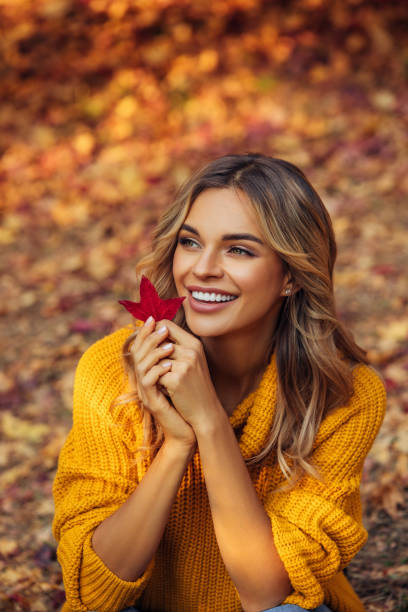 istock Beautiful woman holding a leaf 1333082249