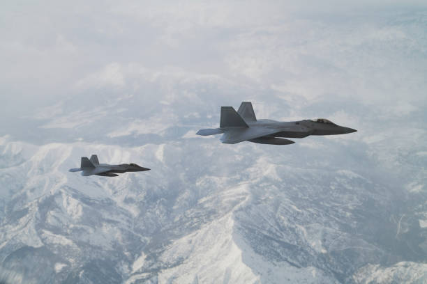 istock Jet fighters flying over the clouds. 1333082682