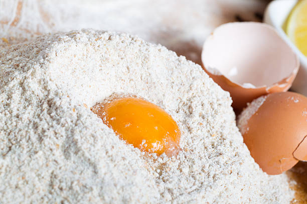 Baking ingredients on a table preparing dough stock photo