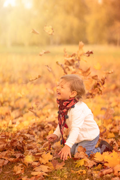 istock Happy child laughing on autumn walk 1333085084