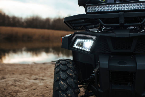 istock headlights in the background a river and sand 1333085833