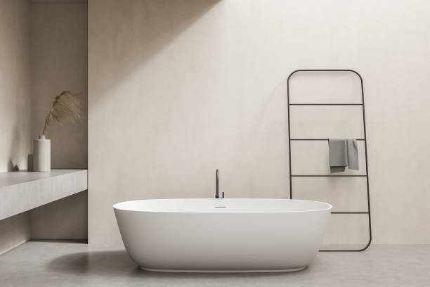 istock Minimalistic beige bathroom with tub and rail 1333086136