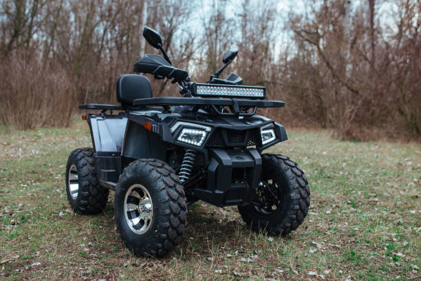 istock black quad bike on green grass 1333086761