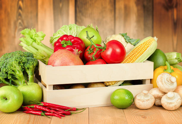 istock fresh vegetables and fruits in a box on the table 1333087139