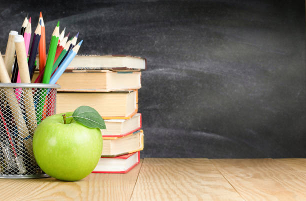 istock pencil holder, books and apple 1333087191