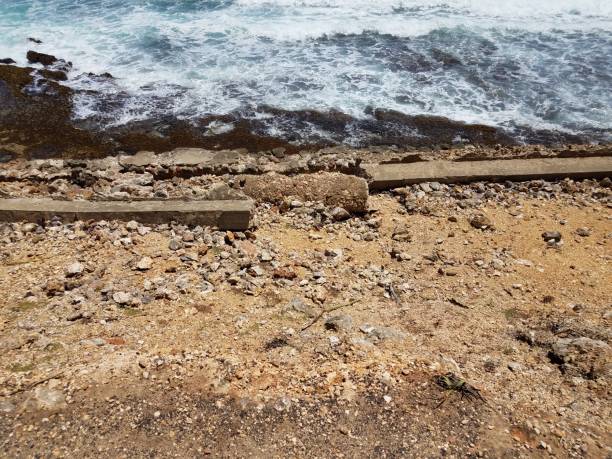 istock cement wall ruins on shore with ocean water 1333087246
